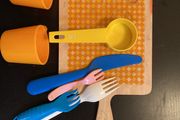 toy wooden chopping board, cutlery, cups