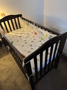 Cot with mattress and side bumpers