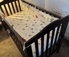 Cot with mattress and side bumpers