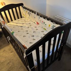 Cot with mattress and side bumpers