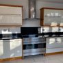 Modern Cream Gloss & Solid Black Granite Kitchen (Includes Electric Range)  North Wicklow Image 2