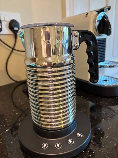 Nespresso espresso machine, milk frother and cups