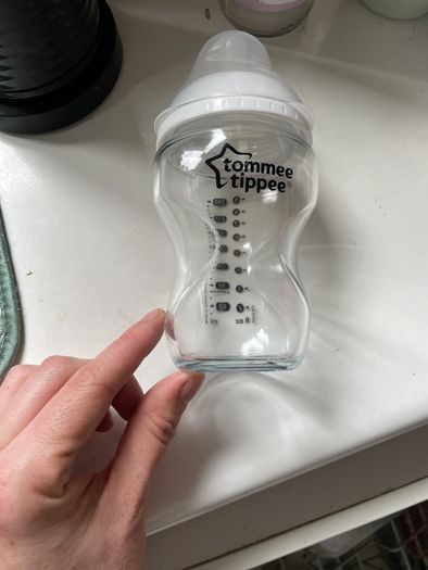2 glass baby bottles