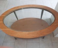 Oval wooden coffee table with glass top