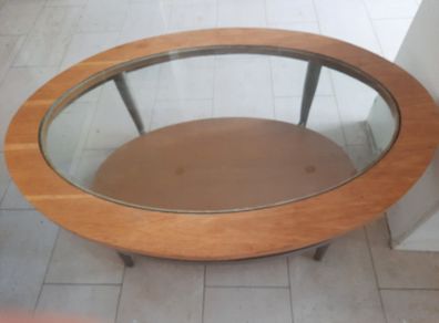 Oval wooden coffee table with glass top