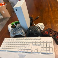 xbox series s, 2controllers and keyboard and mouse includes a cover for controller and the box also includes HDMI cable and Power Cable and headset
