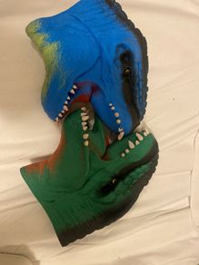 Two dinosaur head mittens
