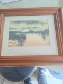 signed print of sea side.