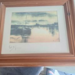 signed print of sea side.