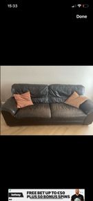 Three seater dark leather sofa