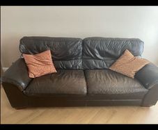 Three seater dark leather sofa
