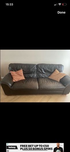 Three seater dark leather sofa