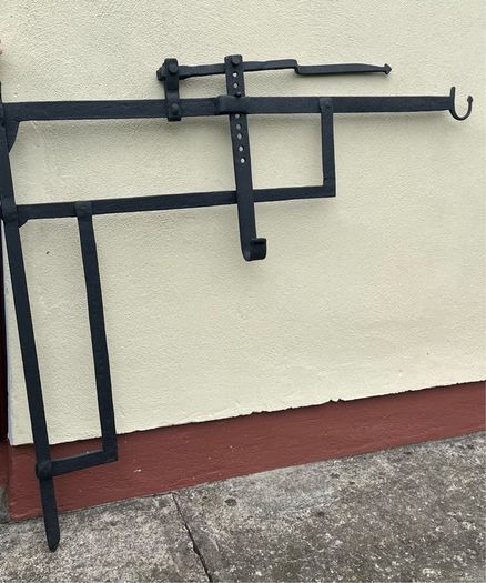 Antique iron crane for fireplace