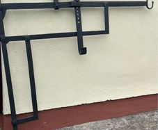 Antique iron crane for fireplace