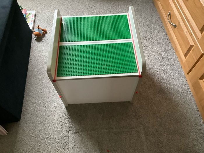 lego box and mixed lego pieces