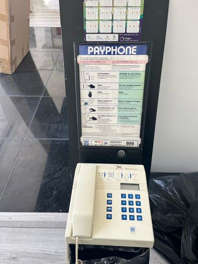 old style payphone. Phone Money vault was opened. Steel bent and open