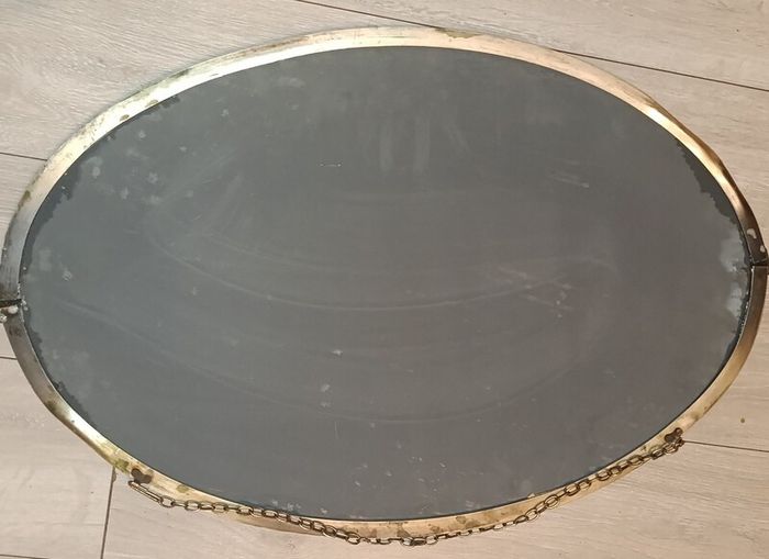 Large antique oval bevelled mirror with brass