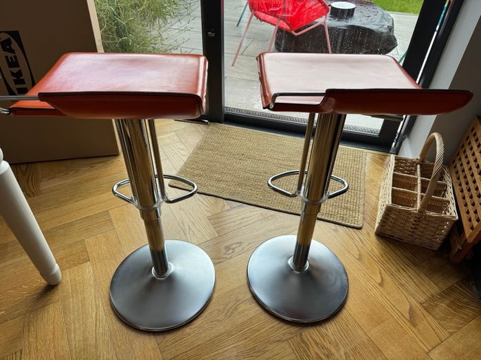 Vintage Italian orange leather bar stools.