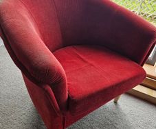 Red fabric tub chair