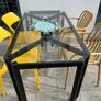 Alfrank metal and glazed dining table, black steel with safety glass tabletop Image 4