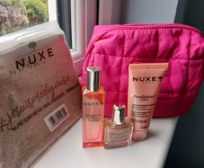 Nuxe pink cosmetic bag with Prodigieux Floral parfum, shower gel and oil, all new