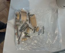 Fittings for drop down side cot