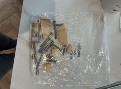 Fittings for drop down side cot