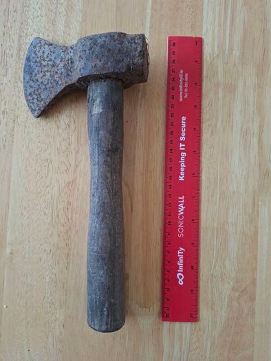 Old hatchet, hand axe.