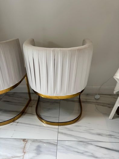 Cream and gold armchairs
