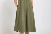 New olive green cotton jersey T-shirt dress features a relaxed oversized fit and convenient side seam pockets