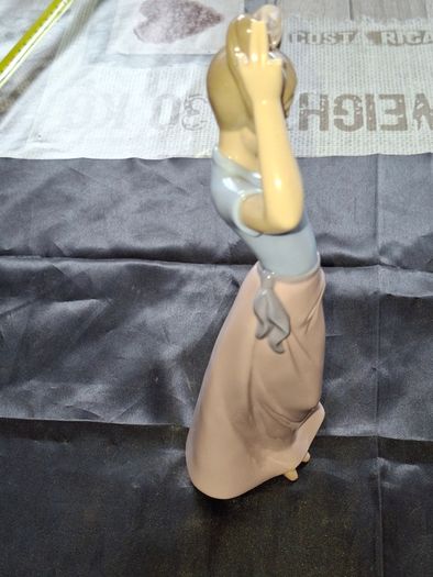 Getting Ready A Young Girl Fixing Her Hair from Nao Porcelain, Lladro, postage available or collection