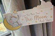 Nursery decor hanging plaque and ornament.