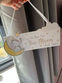 Nursery decor hanging plaque and ornament.