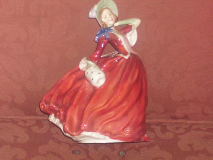 a royal doulton figure of a girl