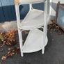 White wicker shelving unit Image 2