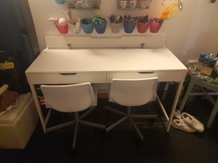 white ikea desk and two chairs