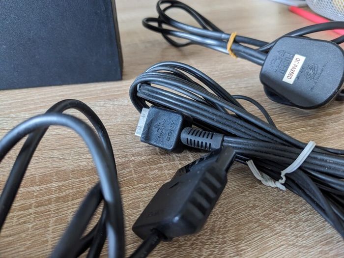 PS2 console with controller and cables