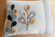 Leaf stem motif cushion