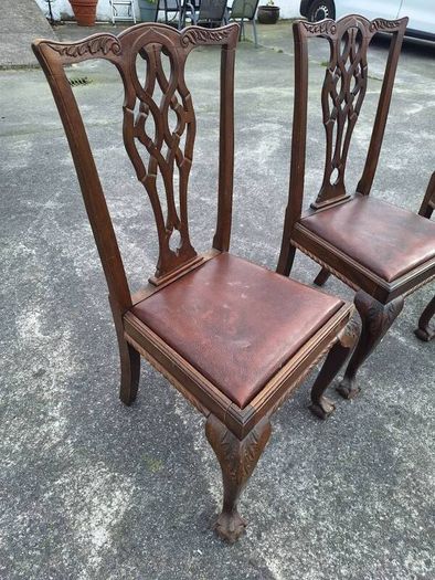 A set of four pierced Chippendale style chairs
