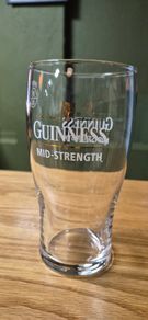 Guinness mid-strength pint glasses