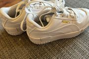 Unisex UK 12 white Puma trainers