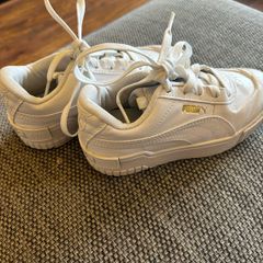Unisex UK 12 white Puma trainers