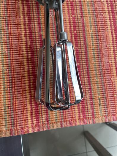 Vintage whisk , steel with orange bakelite handle