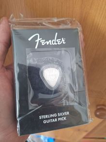 Silver guitar pick