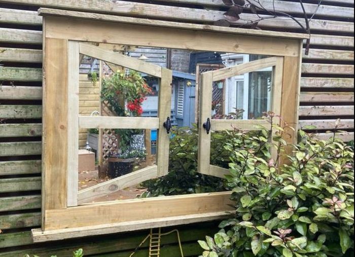 Garden mirror reflection window