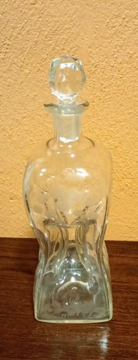 Antique hourglass shaped glass decanter