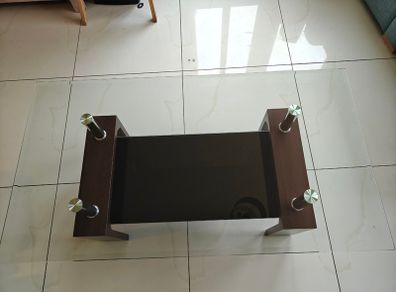Glass coffee table with dark wood base