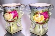 Pair of antique ornate urns with roses