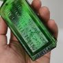 396 - Antique Aceite De Bellotas y Savia De Coco Green Glass Bottle Image 5
