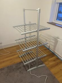 Heated clothes drying rack